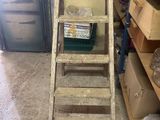 a ladder that is leaning against a wall in a room