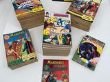 a lot of comic books sitting on a table