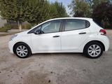 a picture of a small white car parked in a parking lot