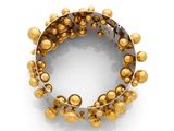 a close up of a gold beaded bracelet on a white background