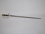 a sword that is laying on a white surface
