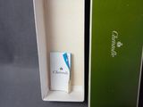 a green box with a blue pen inside of it