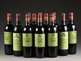 six bottles of wine are lined up in a row on a table