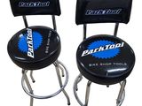 pair of black bar stools with blue logo on them