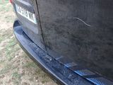 a close up of a car ' s bumper with a sticker on it