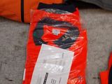 a bag of luggage and a pair of gloves on the floor