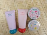 three different types of skin care products on a woven surface