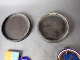 three pans and two pans of food on a table