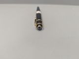 an image of a pen laying on top of a white surface