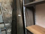a shelf with a bag on top of it in a room