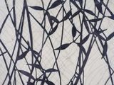 a black and white drawing of a plant on a wall
