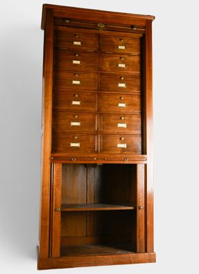 an image of a wooden cabinet with many drawers