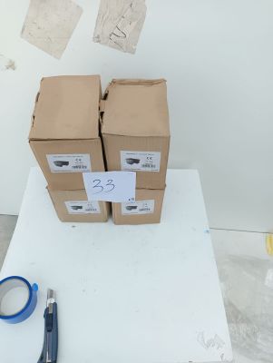 two boxes of paper and a pair of scissors on a table