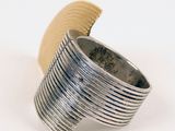 sterling silver ring with stripes of silver and gold on a white background