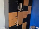 a room with a bunch of cabinets and a refrigerator in it