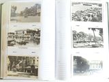 a book opened to show pictures of a city