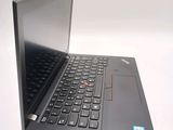 a laptop computer that is open on a white surface