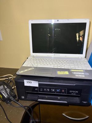 a laptop computer sitting on top of a dvd player