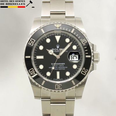 une montre Rolex avec un cadran noir et un bracelet