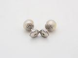 pair of pearl earrings on a white background