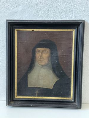 portrait d'un homme vêtu d'une robe noire et blanche et coiffé d'un chapeau noir