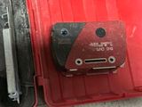 a red case with a tool in it on the floor