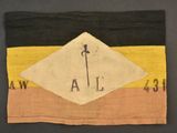 a close up of a piece of cloth with an arrow on it