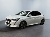 the white car is parked in a room with a gray floor