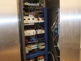 an image of a refrigerator with many wires in it
