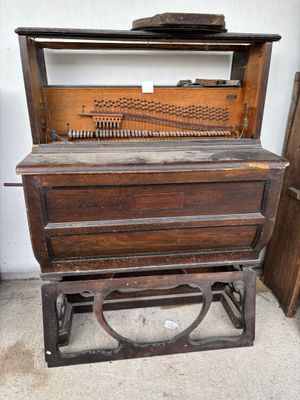 an old piano that is sitting in a room