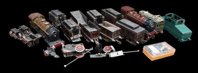 many different types of toy trains on a black background