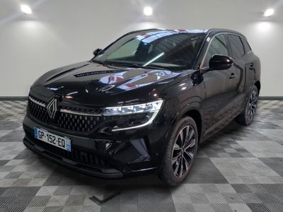 the front view of a black suv parked on a checkered floor