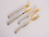 four silverware spoons and two silverware spoons on a white surface