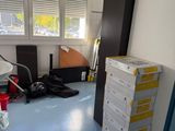 boxes stacked on top of each other in a room with a window