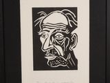a black and white drawing of a man with a mustache
