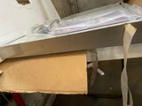 a box with a bunch of papers on top of it