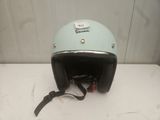 a helmet on a table with a tag on it