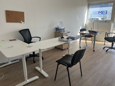 an office with a desk, chair, and computer monitor