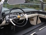 a black and white car with a steering wheel and dashboard