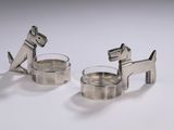 pair of silver plated dog napkin holders on a white background