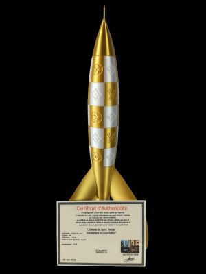 gold and silver rocket award on black background with certificate