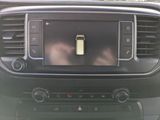 a picture of a car dashboard with a cell phone in it