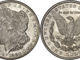 a close up of two silver morgan dollars on a white background
