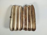 pair of antique silver plated cigarette cases on a white surface