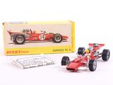 a red toy race car next to a box of matches