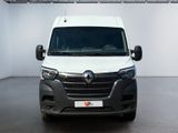 the front view of a white van parked in a garage