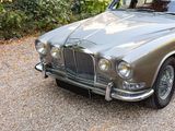 a silver car that is parked in the driveway