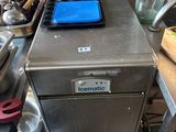 an image of a commercial kitchen with a lot of cooking utensils