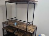 hardwood flooring in a room with a desk and a shelf