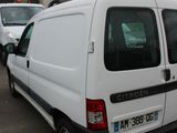 a white van that is parked in a parking lot